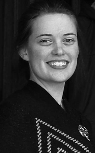 black and white profile image of Rachel Mills.